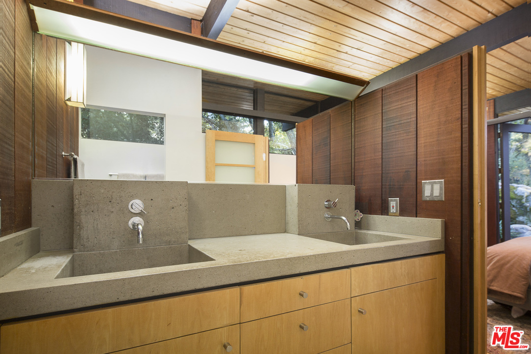 616 Cold Canyon Road Calabasas, CA 91302 - Photo 20 of 51 a bathroom with a sink and a mirror