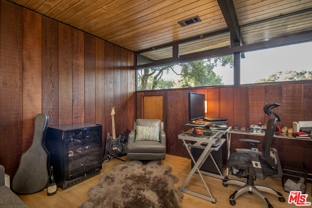 616 Cold Canyon Road Calabasas, CA 91302 - Photo 23 of 51 a work room with furniture and musical instruments
