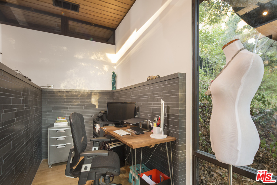 616 Cold Canyon Road Calabasas, CA 91302 - Photo 25 of 51 a balcony with table and chairs