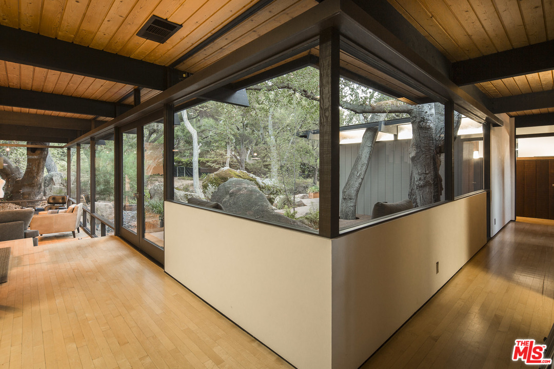 616 Cold Canyon Road Calabasas, CA 91302 - Photo 27 of 51 a view of a room with wooden floor and furniture