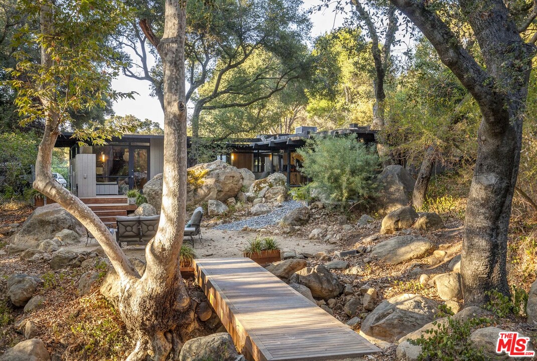 616 Cold Canyon Road Calabasas, CA 91302 - Photo 35 of 51 a view of a chairs and tables in the patio