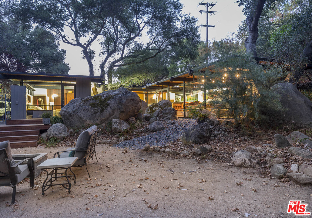 616 Cold Canyon Road Calabasas, CA 91302 - Photo 42 of 51 a view of backyard with outdoor seating and green space