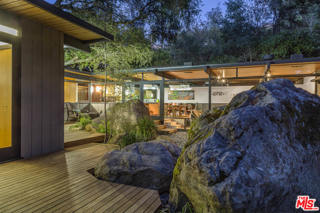 616 Cold Canyon Road Calabasas, CA 91302 - Photo 44 of 51 a view of a house with backyard and garden