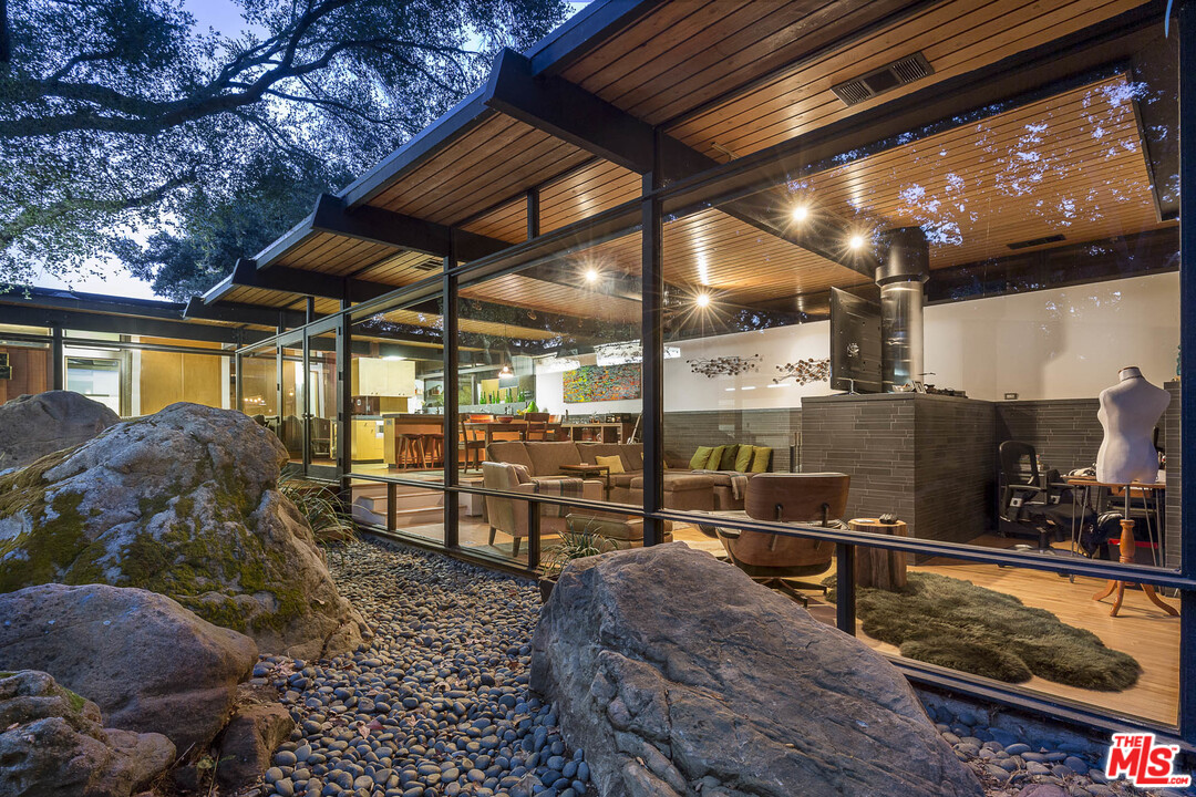 616 Cold Canyon Road Calabasas, CA 91302 - Photo 46 of 51 a view of a chairs and table in a patio