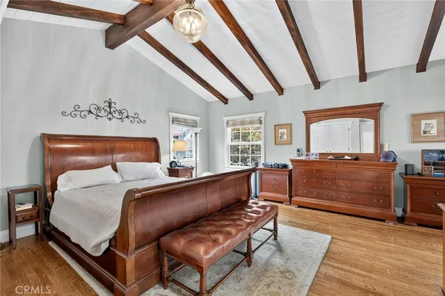 a bedroom with furniture and a window