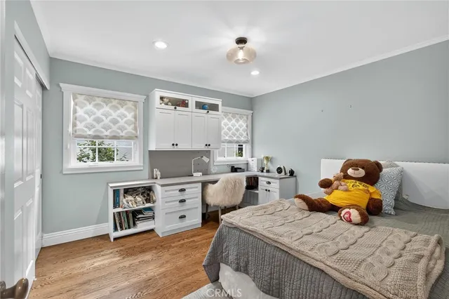 a bedroom with furniture and a window