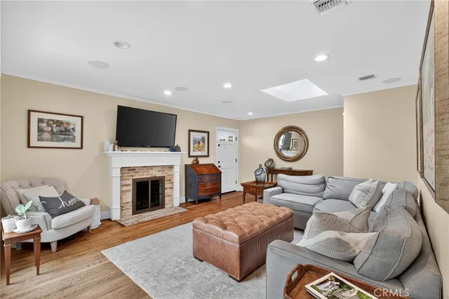 a living room with furniture or couch and a fireplace