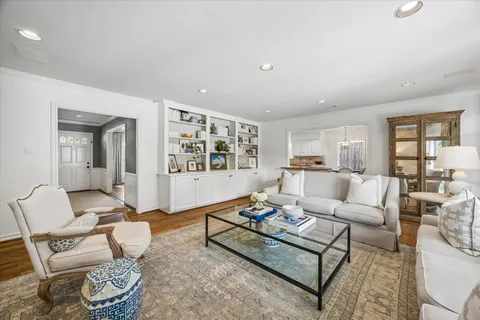 a living room with furniture and a table