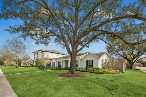a view of house with a yard