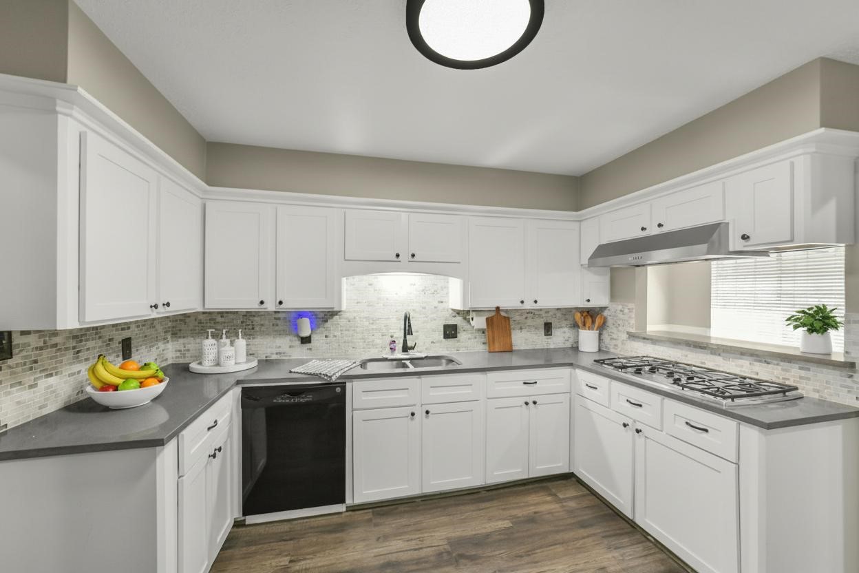 25302 Fairbrook Lane Spring, TX 77373 - Photo 12 of 49 a kitchen with a sink dishwasher stove and white cabinets