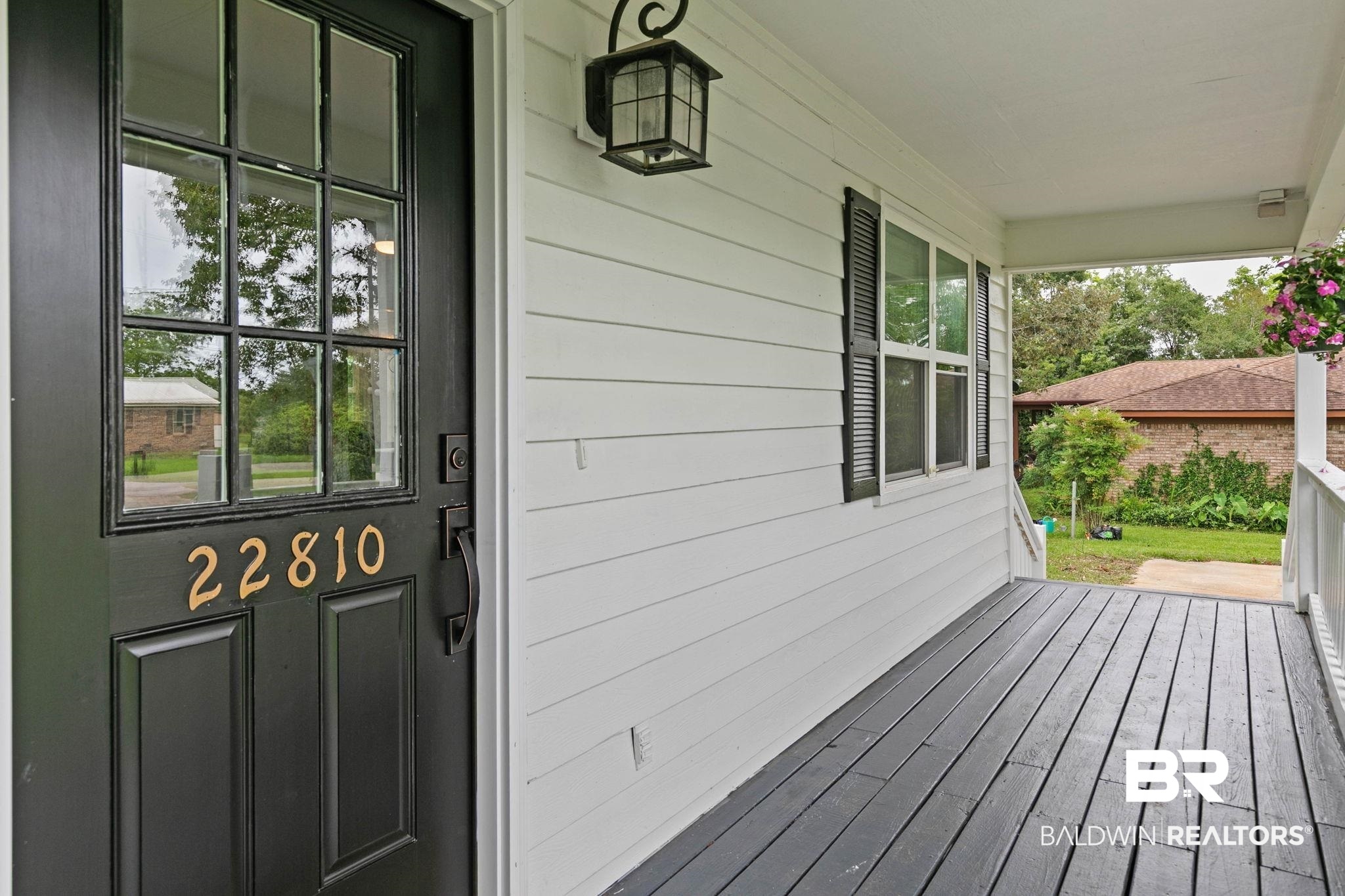 22810 High Ridge Road Fairhope, AL 36532 - Photo 17 of 78 Covered front porch featuring wood-finish flooring and white siding