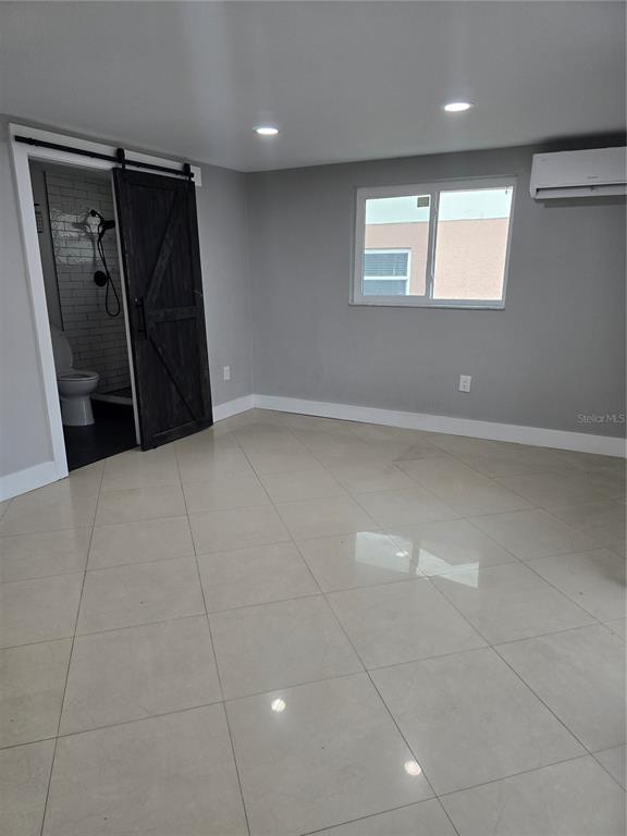 5813 Chapman Drive New Port Richey, FL 34652 - Photo 11 of 33 a view of an empty room and a window