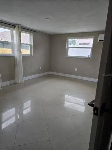 a view of an empty room and window