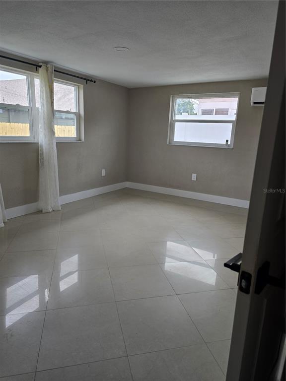 5813 Chapman Drive New Port Richey, FL 34652 - Photo 23 of 33 a view of an empty room and window