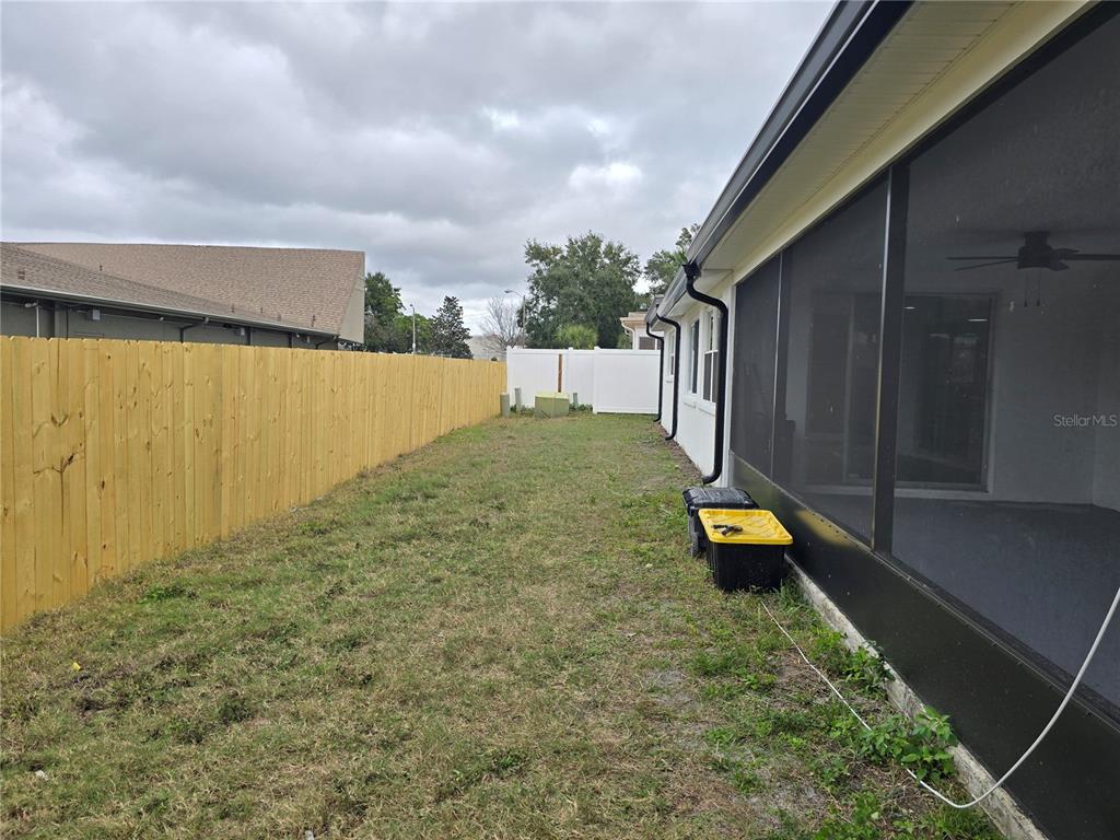 5813 Chapman Drive New Port Richey, FL 34652 - Photo 31 of 33 a view of a backyard with swimming pool