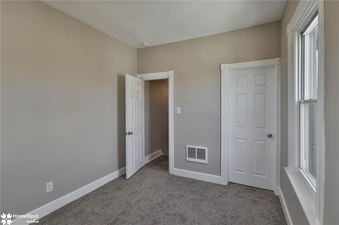 619 Sioux Street Bethlehem, PA 18015 - Photo 37 of 61 A well-lit bedroom features plush carpeting and convenient closet access.