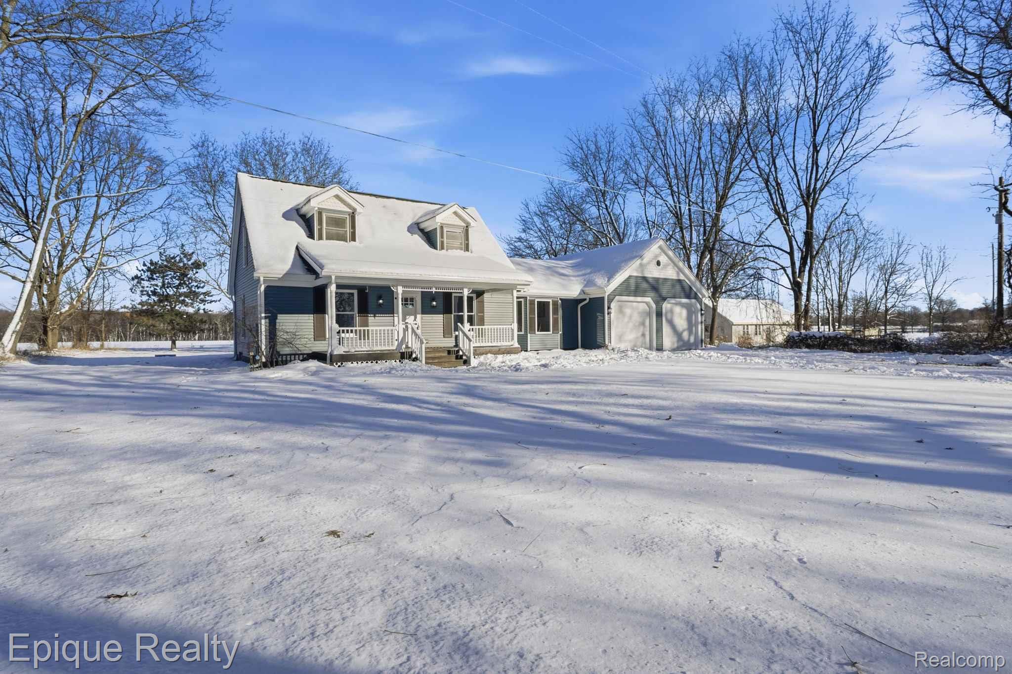 8680 Oakhill Road Clarkston, MI 48348 - Photo 52 of 52 New england style home with covered porch and a garage