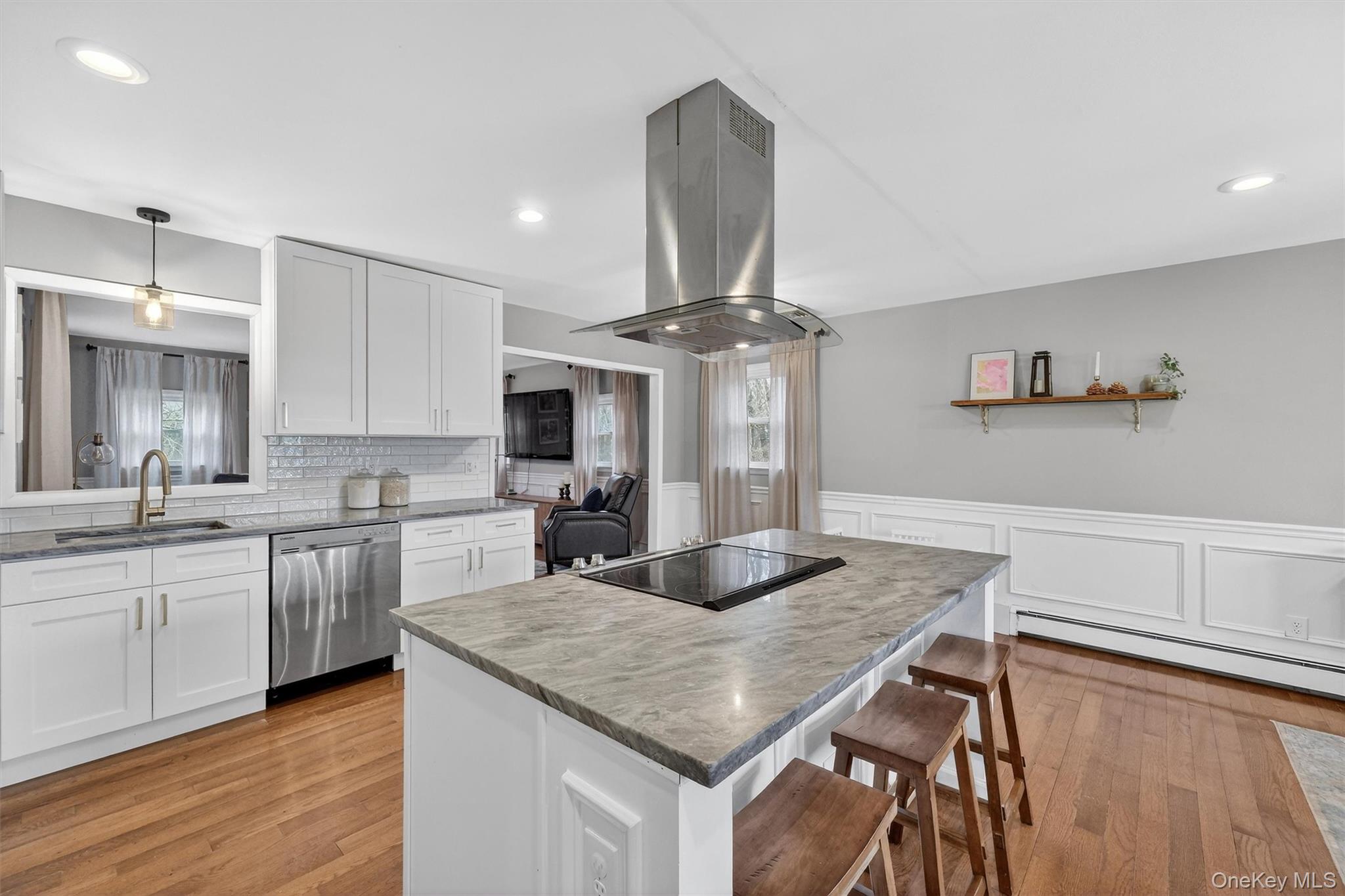 21 Russo Road Hopewell Junction, NY 12533 - Photo 10 of 41 a kitchen with stainless steel appliances granite countertop a sink dishwasher and stove with wooden floor
