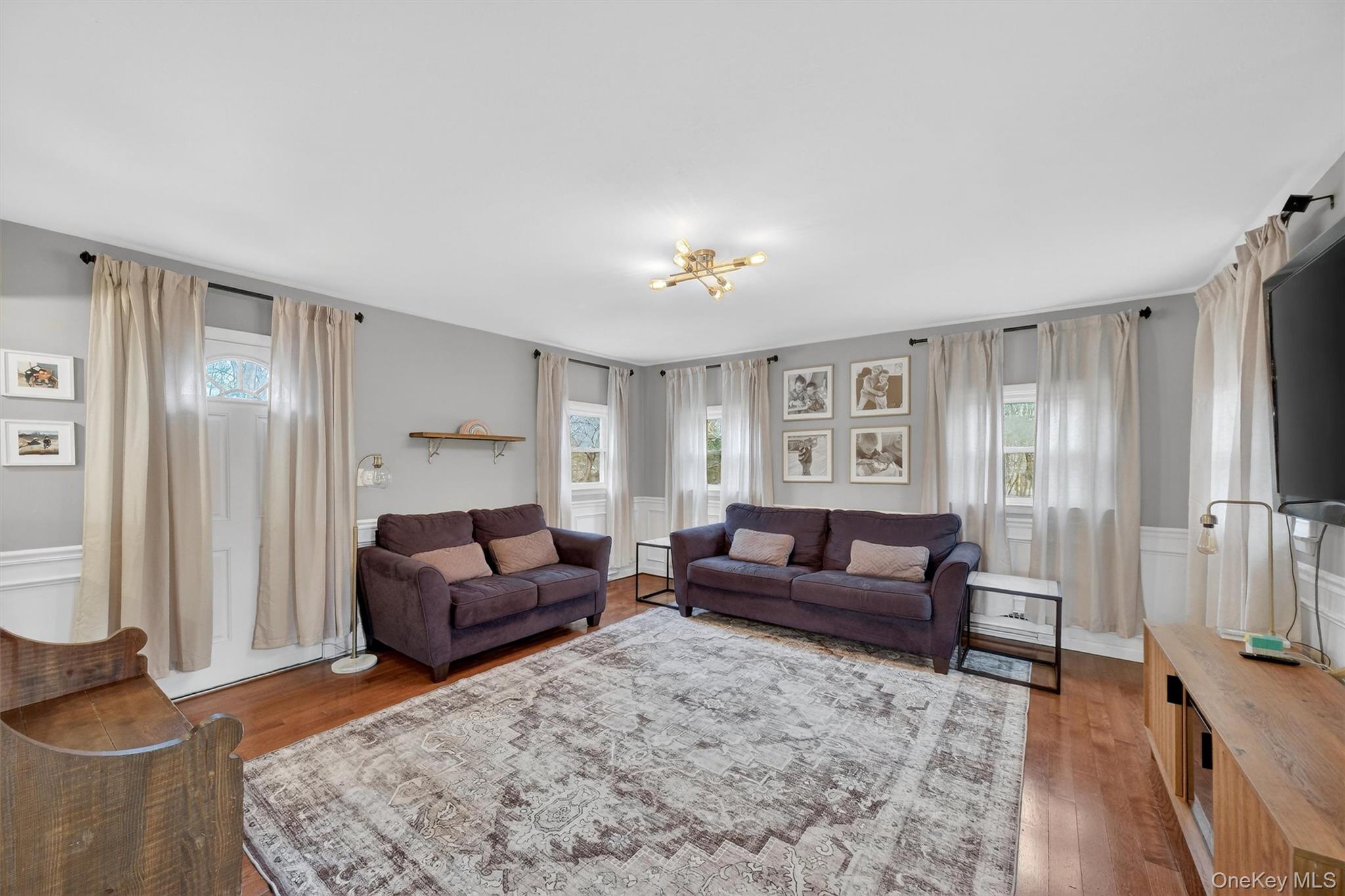 21 Russo Road Hopewell Junction, NY 12533 - Photo 13 of 41 a living room with furniture and a wooden floor