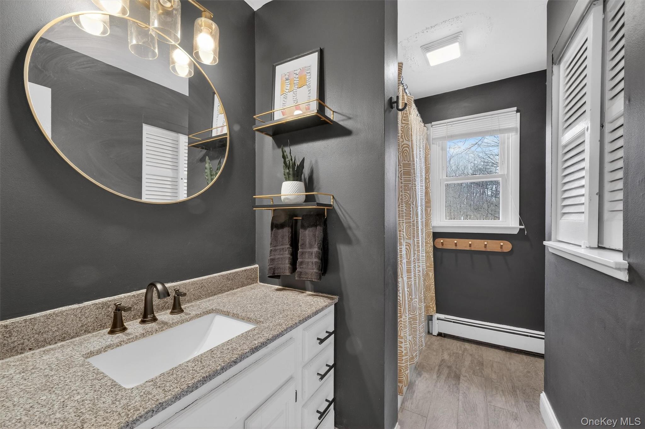21 Russo Road Hopewell Junction, NY 12533 - Photo 17 of 41 a en suite bathroom with a granite countertop sink and mirror