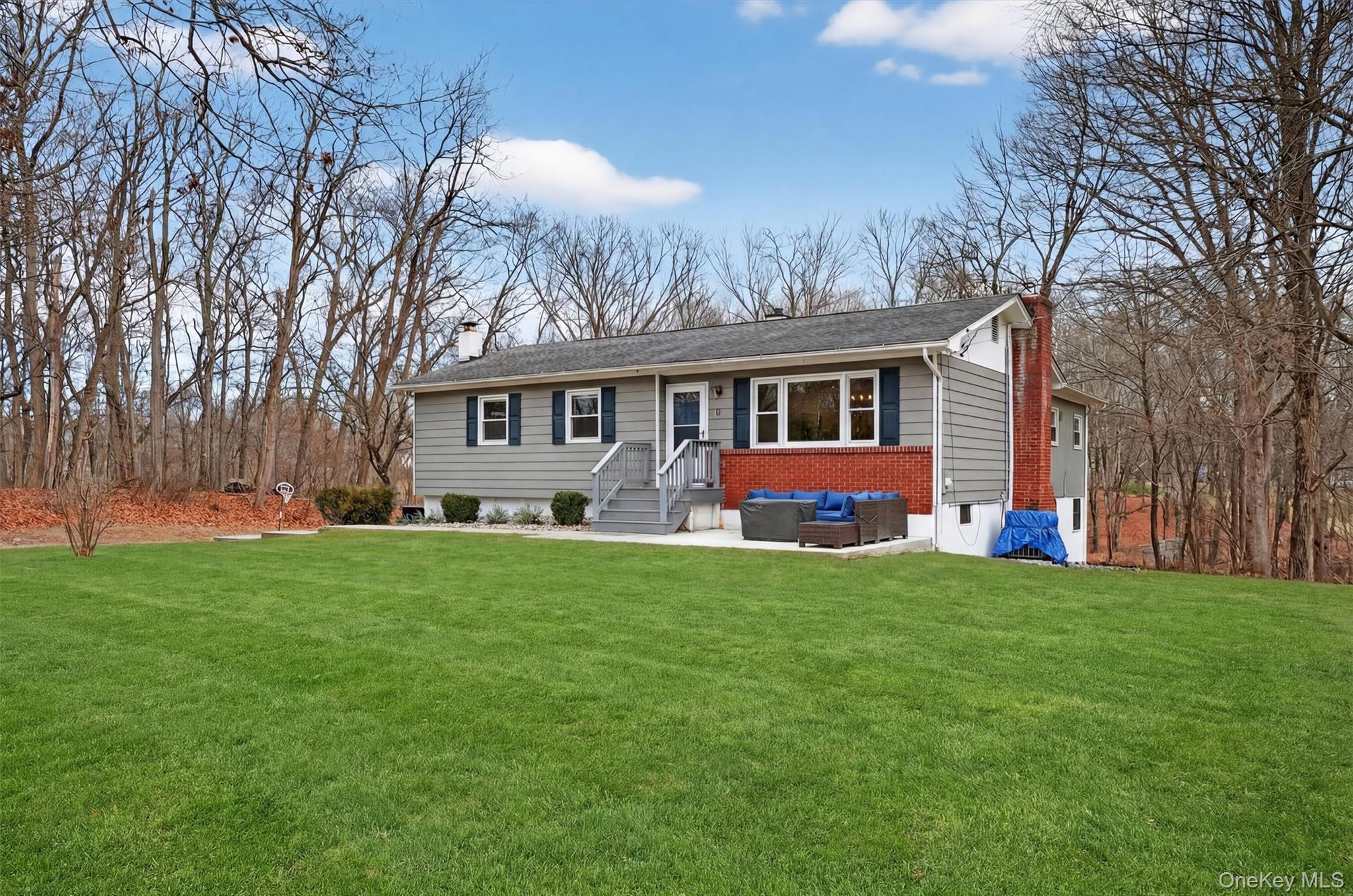 21 Russo Road Hopewell Junction, NY 12533 - Photo 2 of 41 front view of a house with a yard