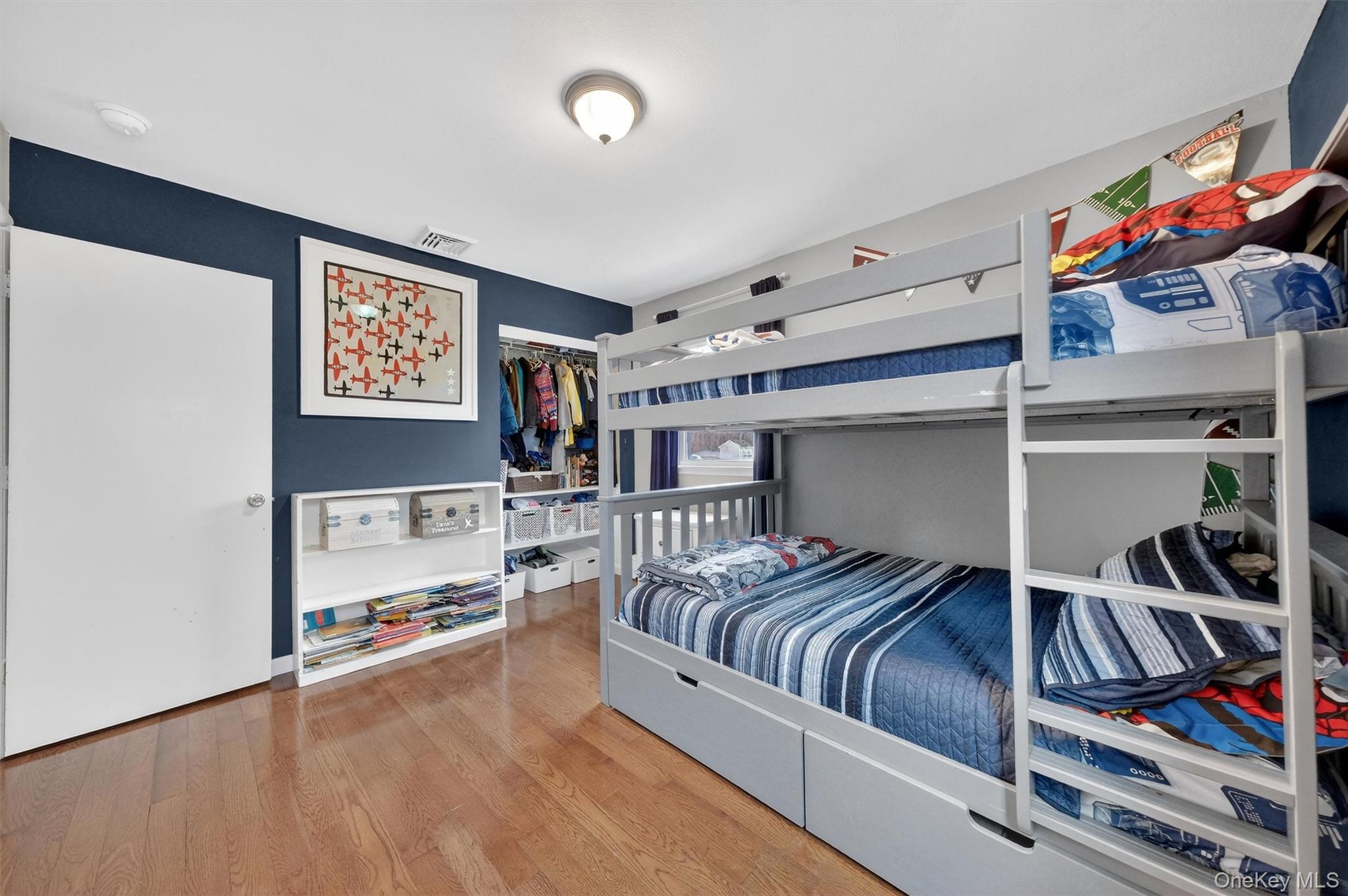 21 Russo Road Hopewell Junction, NY 12533 - Photo 21 of 41 a bedroom with furniture and a book shelf