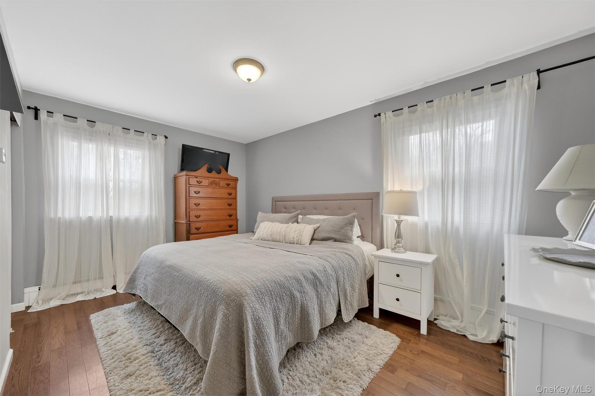 21 Russo Road Hopewell Junction, NY 12533 - Photo 22 of 41 a bedroom with a bed and a chandelier