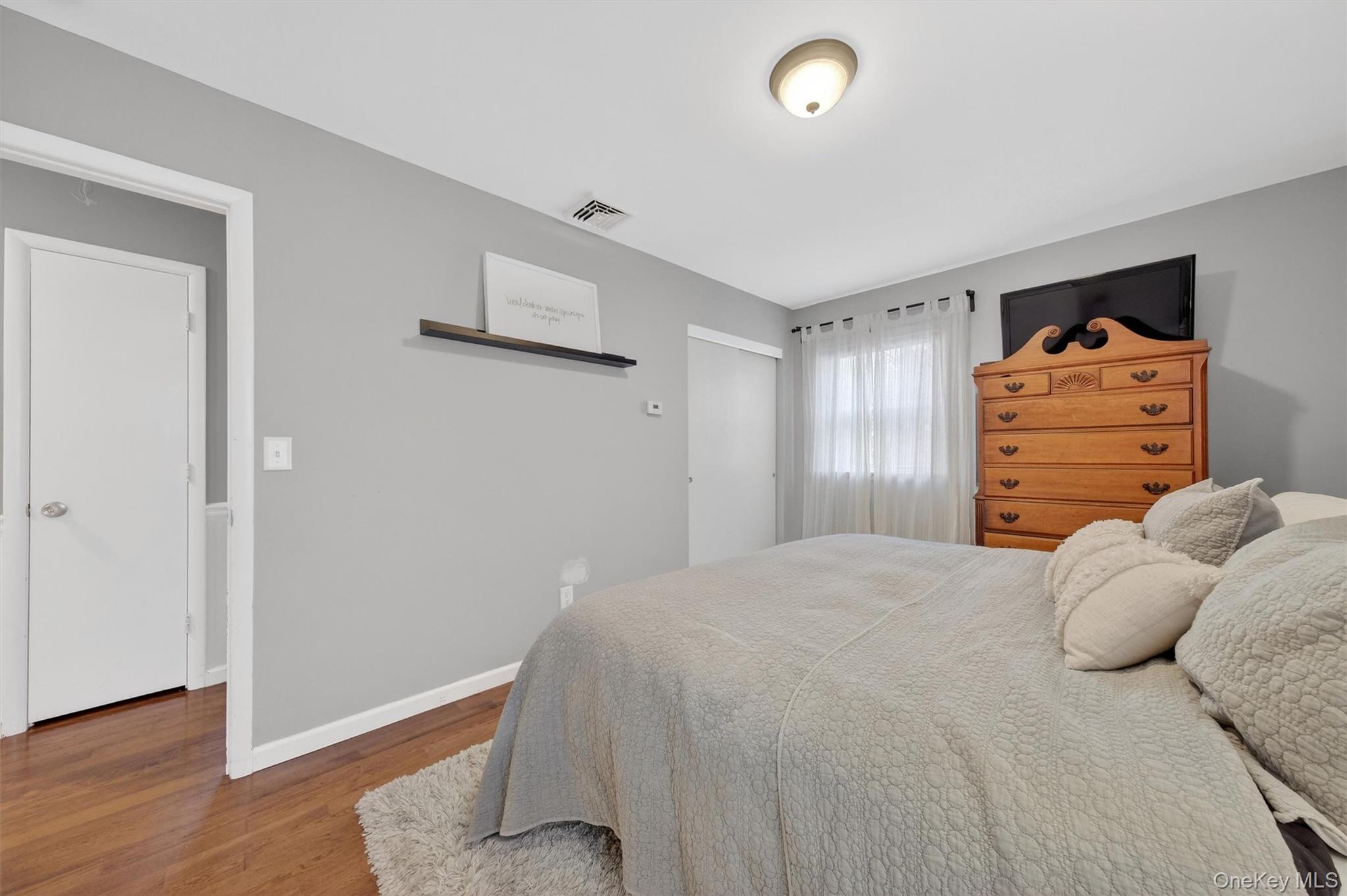 21 Russo Road Hopewell Junction, NY 12533 - Photo 23 of 41 a bedroom with a bed and wooden floor