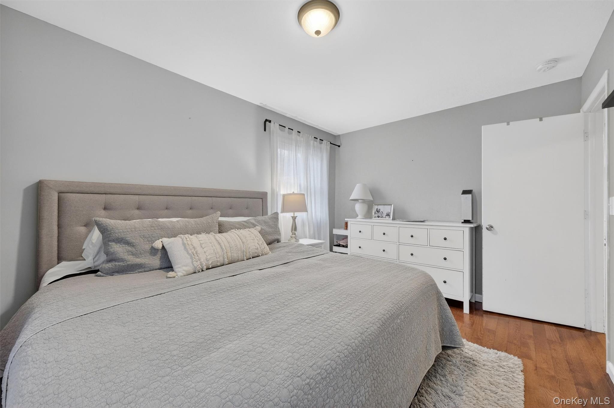 21 Russo Road Hopewell Junction, NY 12533 - Photo 24 of 41 a bedroom with a bed and wooden floor