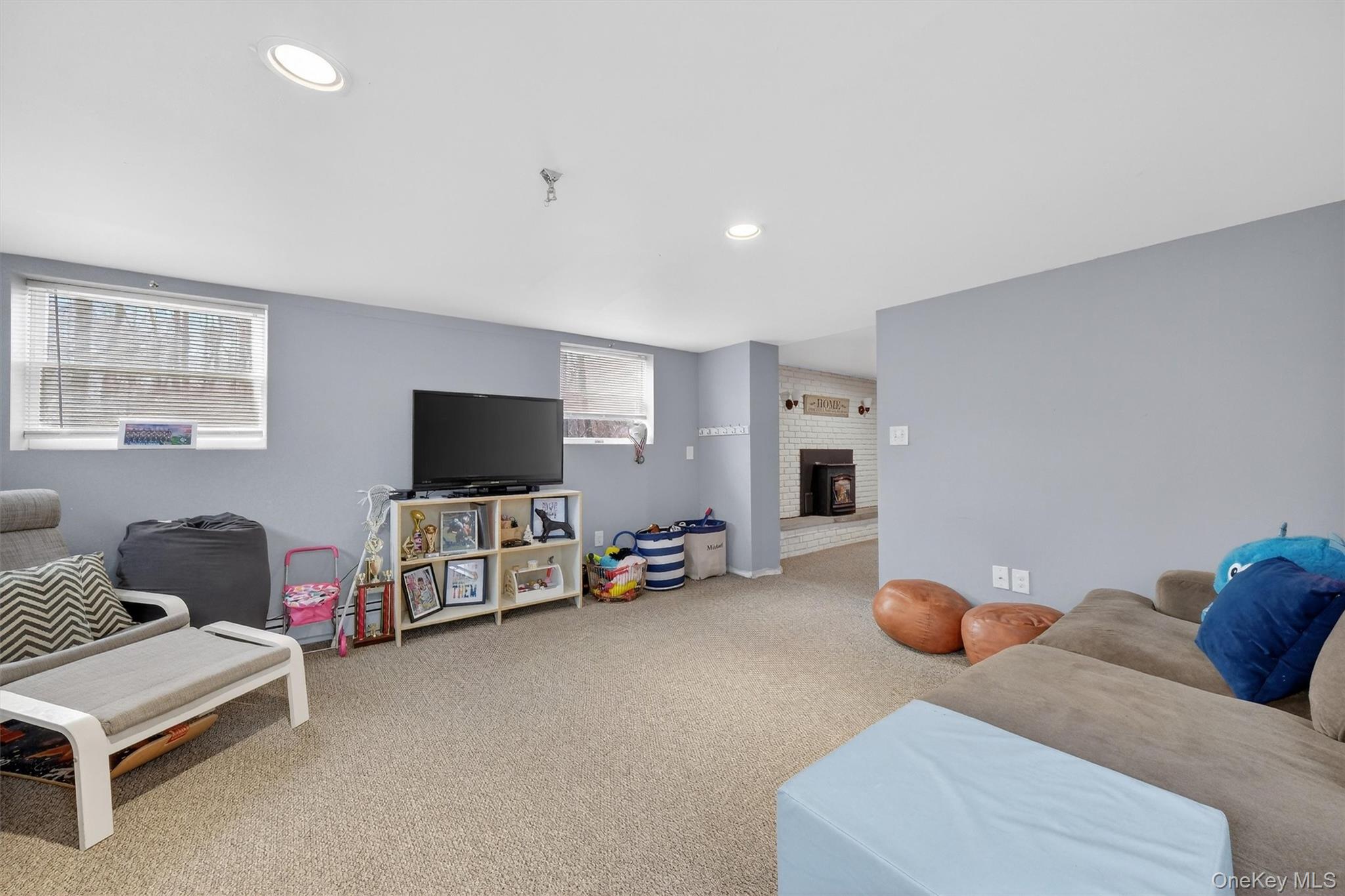 21 Russo Road Hopewell Junction, NY 12533 - Photo 32 of 41 a living room with furniture and a flat screen tv