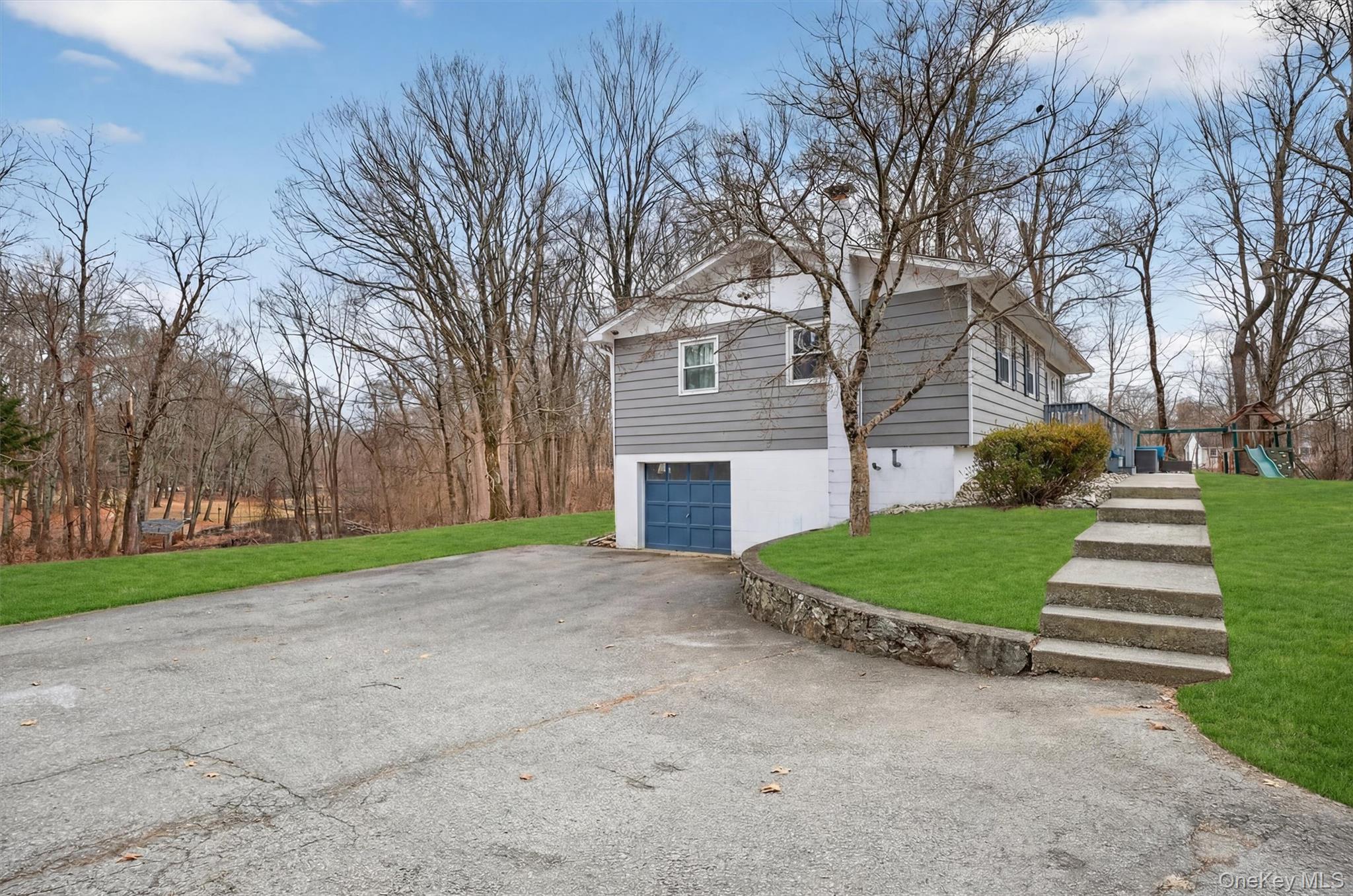 21 Russo Road Hopewell Junction, NY 12533 - Photo 35 of 41 a view of a house with a yard and large trees