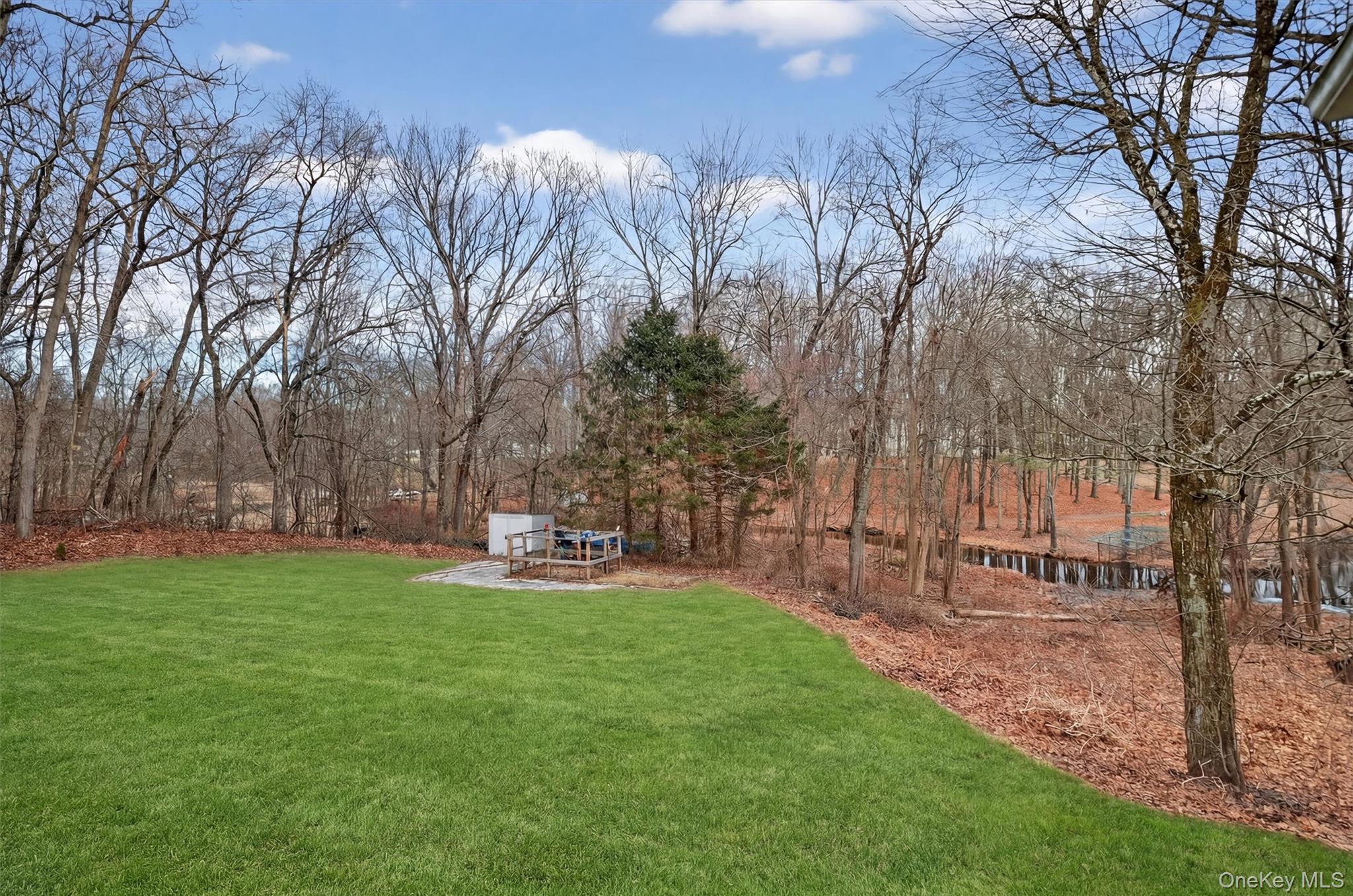 21 Russo Road Hopewell Junction, NY 12533 - Photo 38 of 41 a backyard of a house with table and chairs
