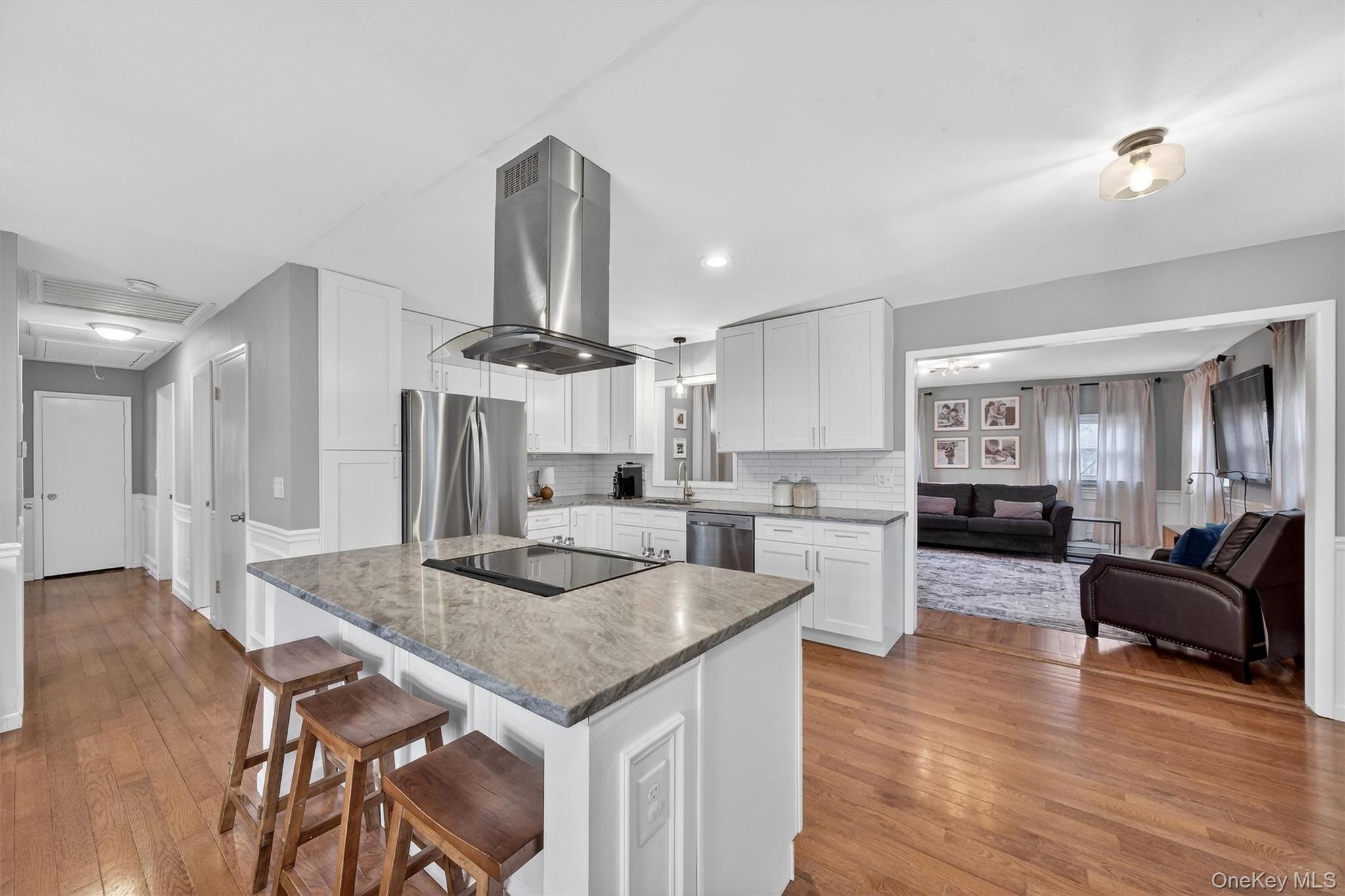 21 Russo Road Hopewell Junction, NY 12533 - Photo 9 of 41 a kitchen with granite countertop kitchen island stainless steel appliances a table chairs sink and stove