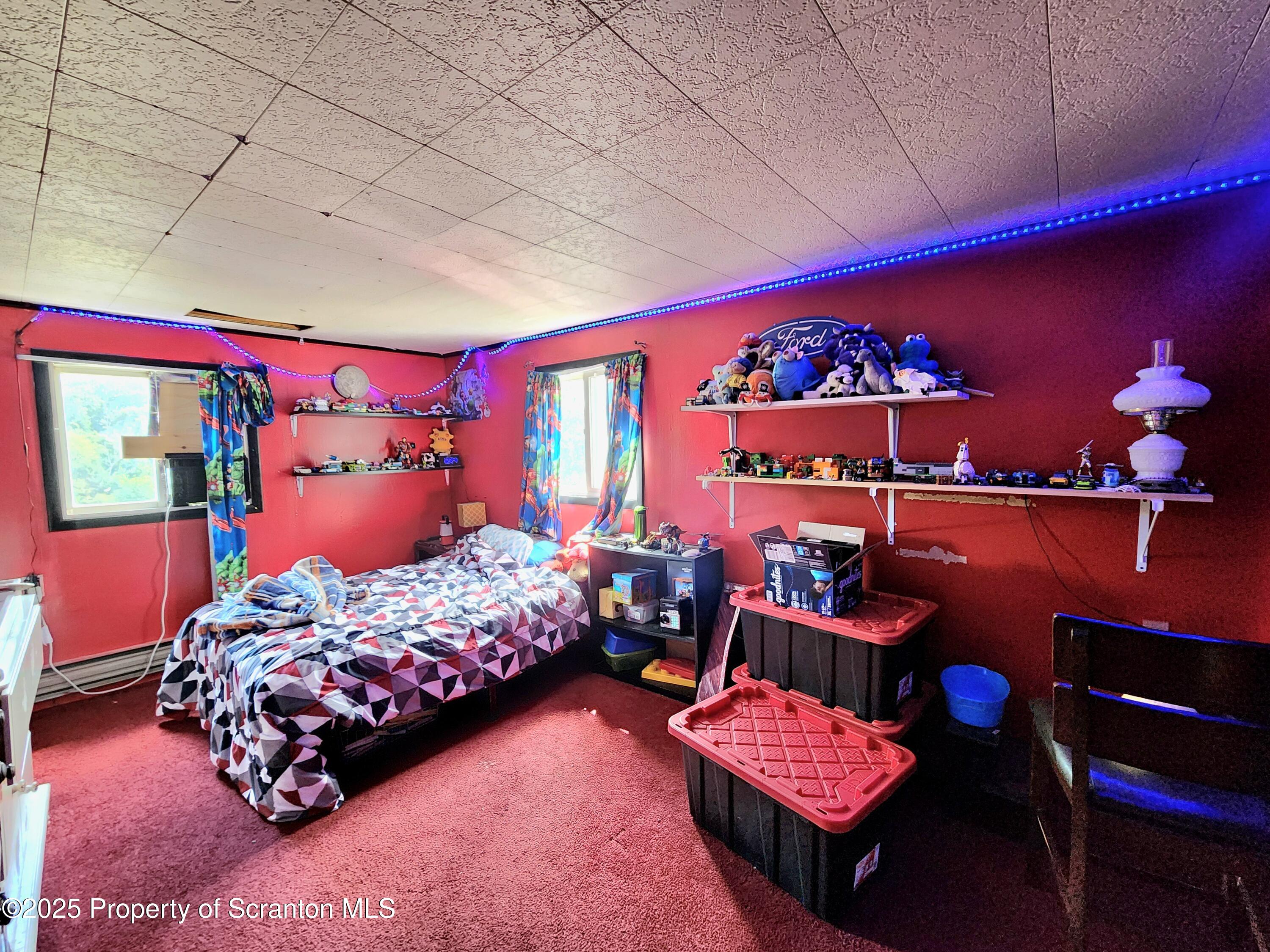 365 Carpenter Road Factoryville, PA 18419 - Photo 11 of 30 a bedroom with two beds and a lamp