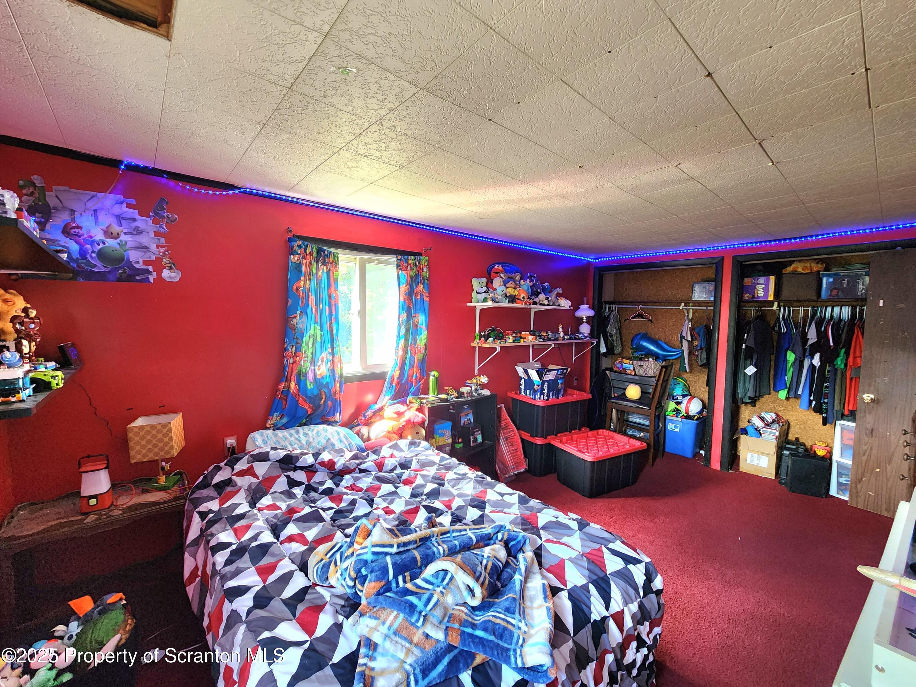 365 Carpenter Road Factoryville, PA 18419 - Photo 12 of 30 a bedroom with a bed and a bookshelf
