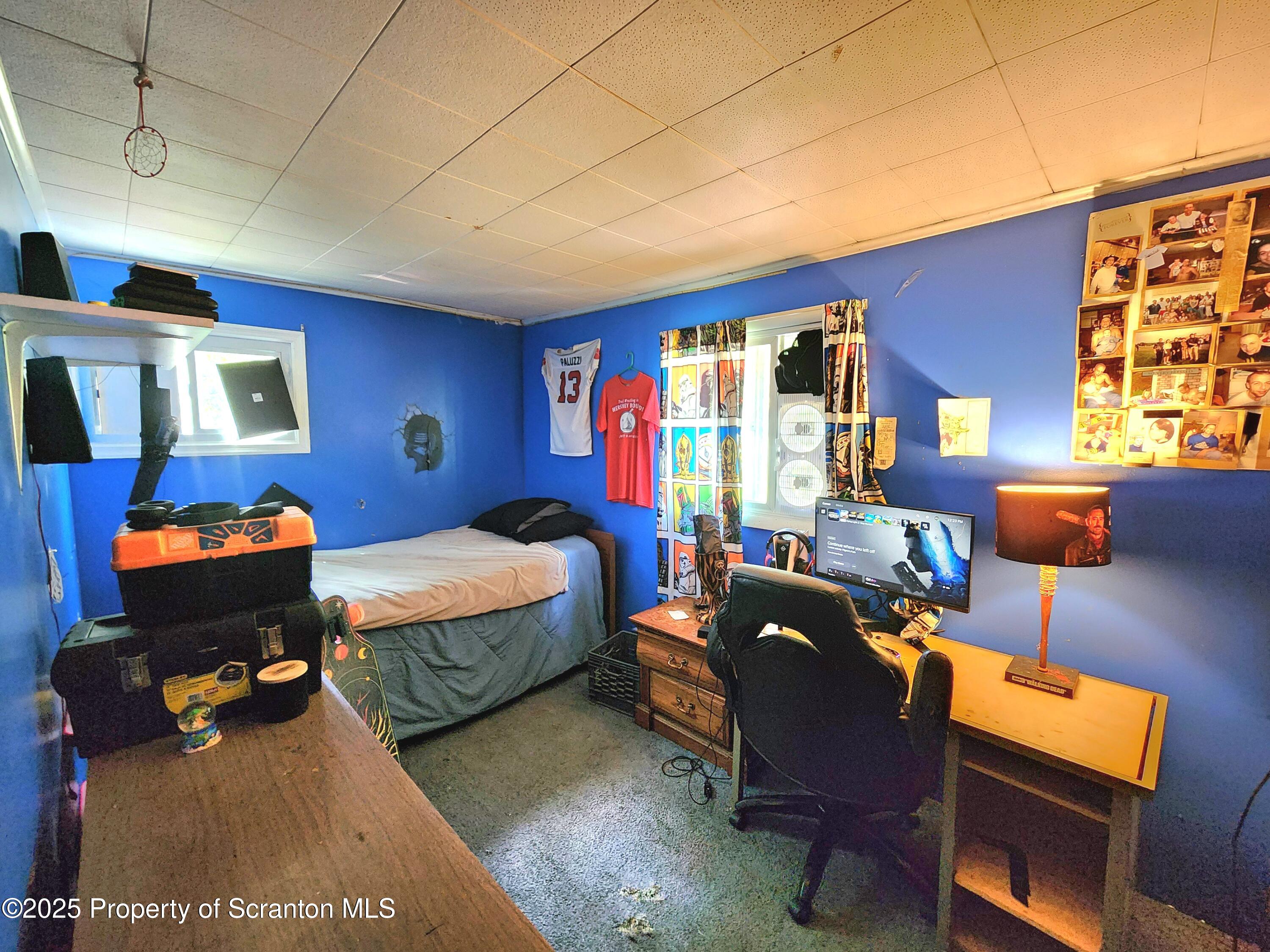 365 Carpenter Road Factoryville, PA 18419 - Photo 13 of 30 a bedroom with furniture and a window