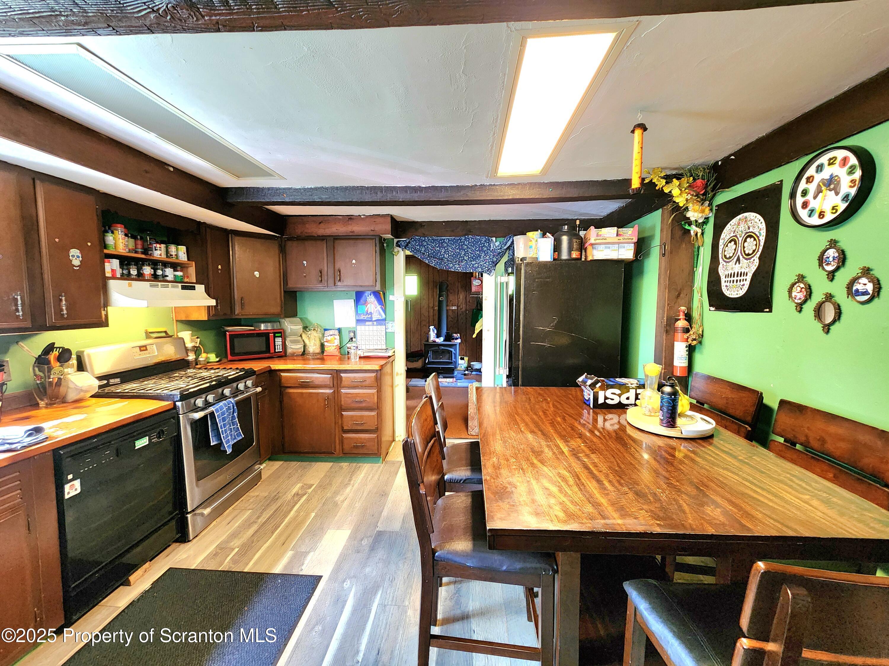 365 Carpenter Road Factoryville, PA 18419 - Photo 2 of 30 a kitchen with stainless steel appliances granite countertop a sink and wooden cabinets