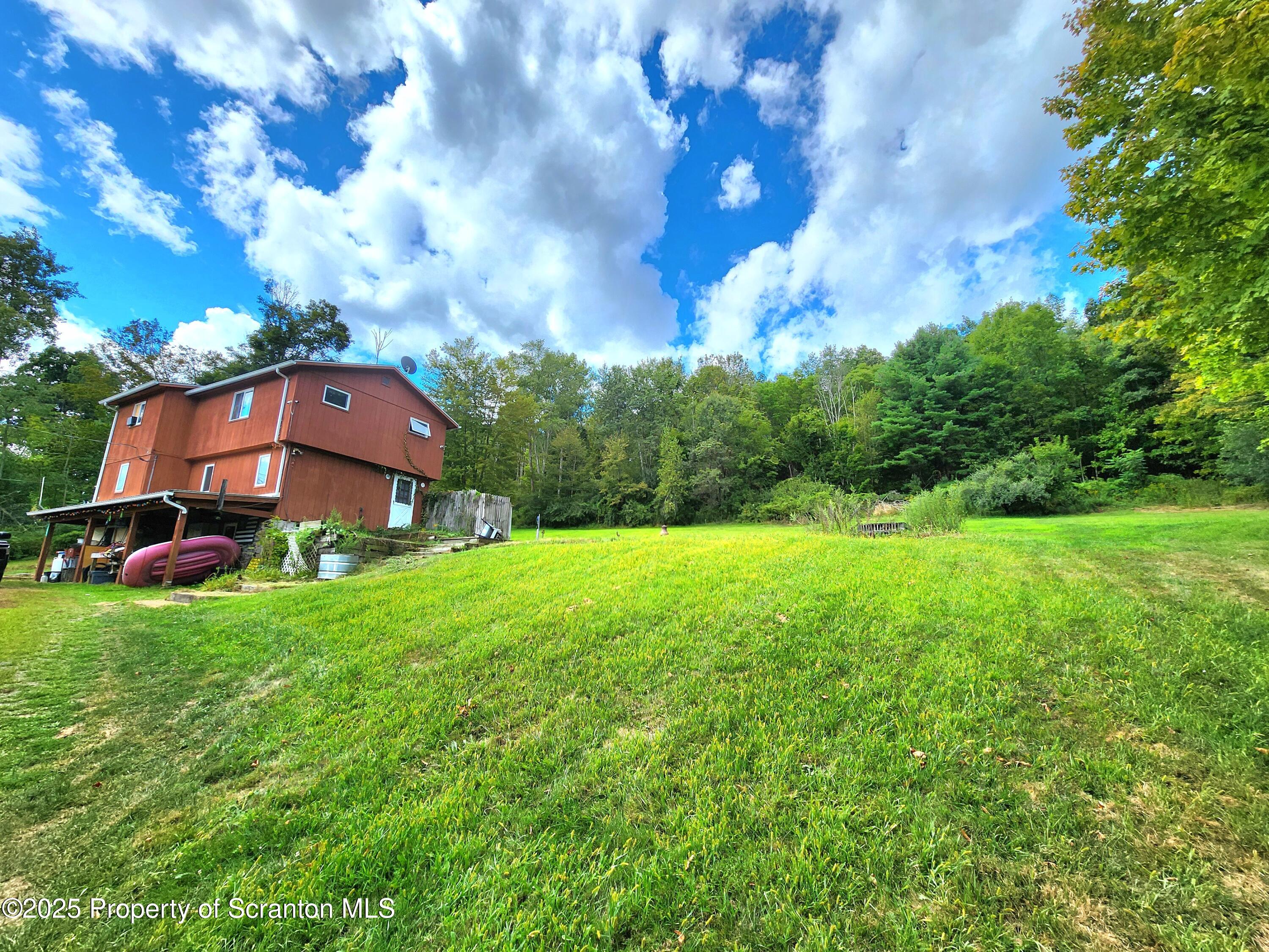 365 Carpenter Road Factoryville, PA 18419 - Photo 28 of 30 a view of a big house with a big yard and large trees