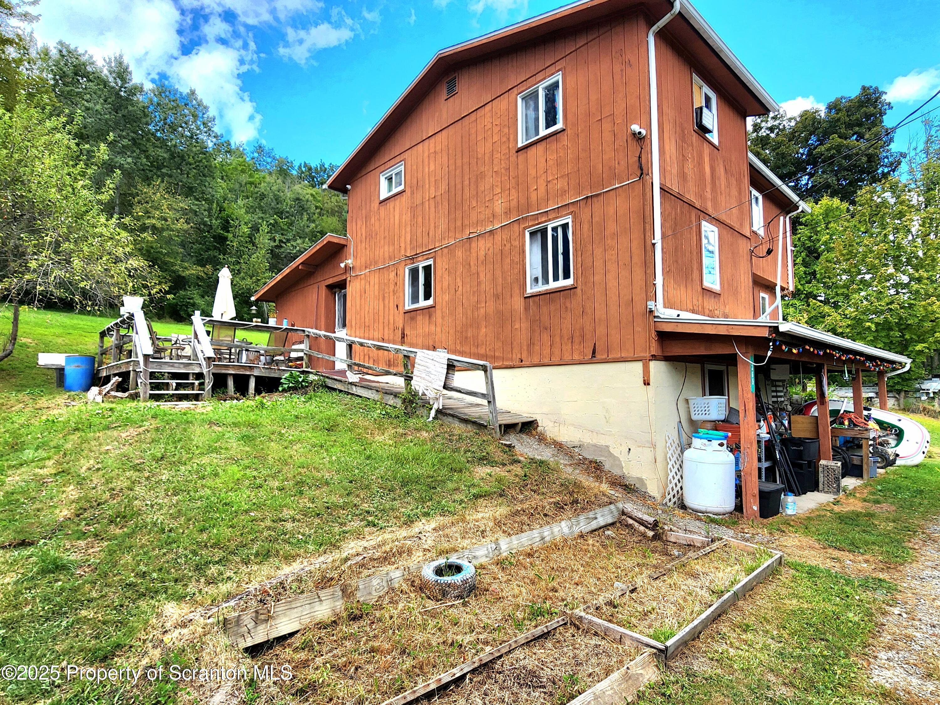 365 Carpenter Road Factoryville, PA 18419 - Photo 30 of 30 a front view of a house with garden
