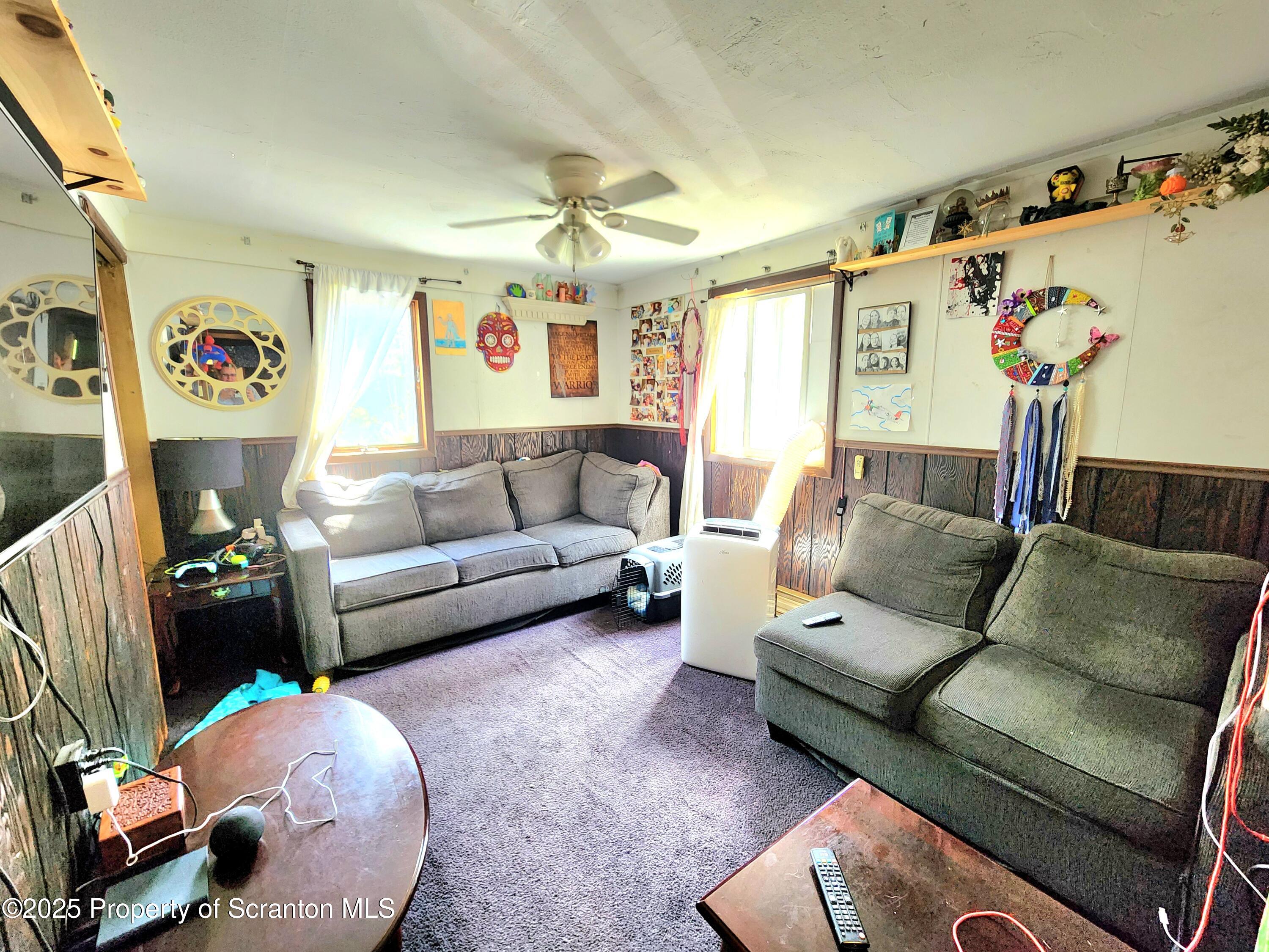365 Carpenter Road Factoryville, PA 18419 - Photo 4 of 30 a living room with furniture and a couch