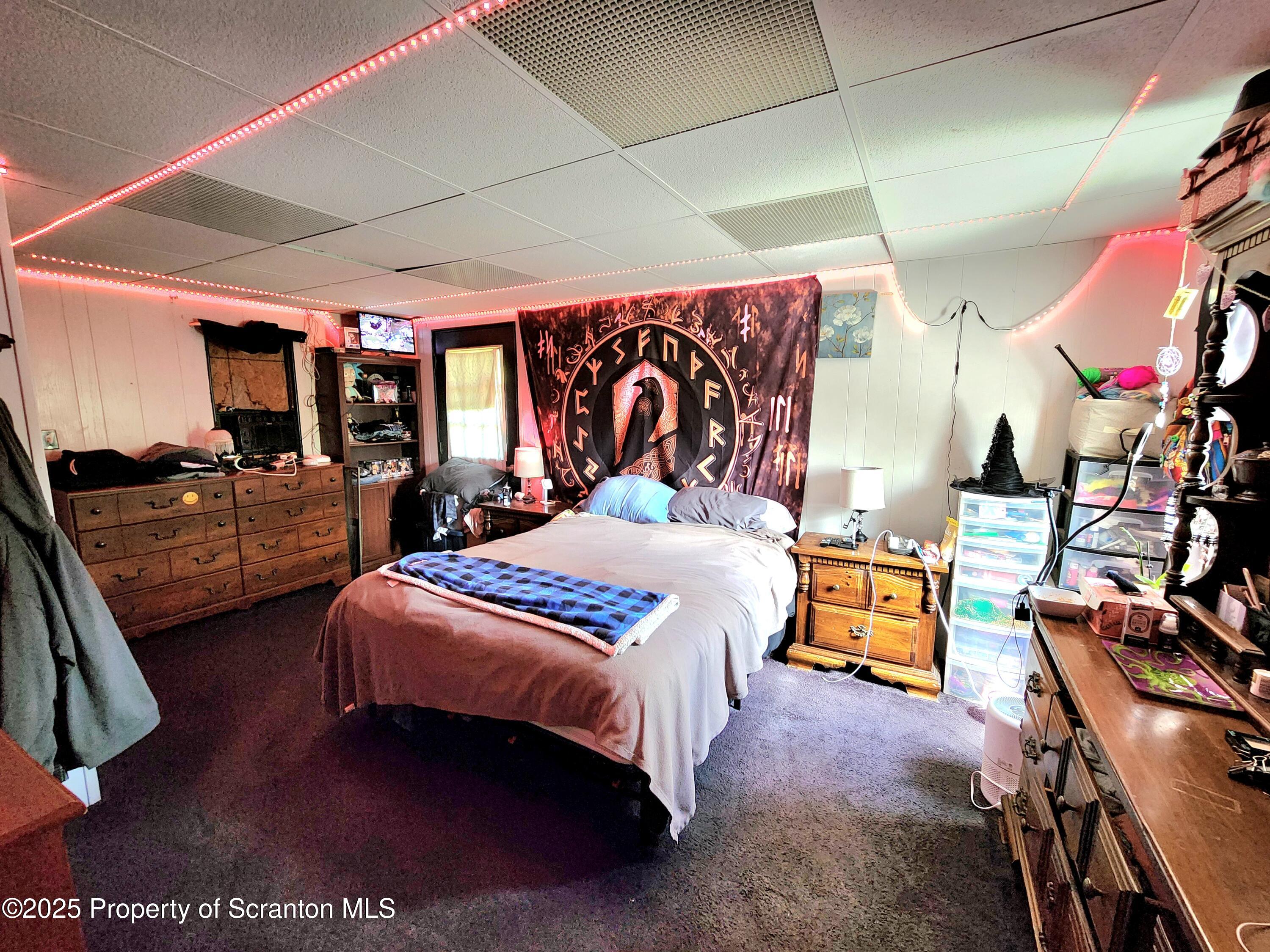 365 Carpenter Road Factoryville, PA 18419 - Photo 6 of 30 a bedroom with bed and window