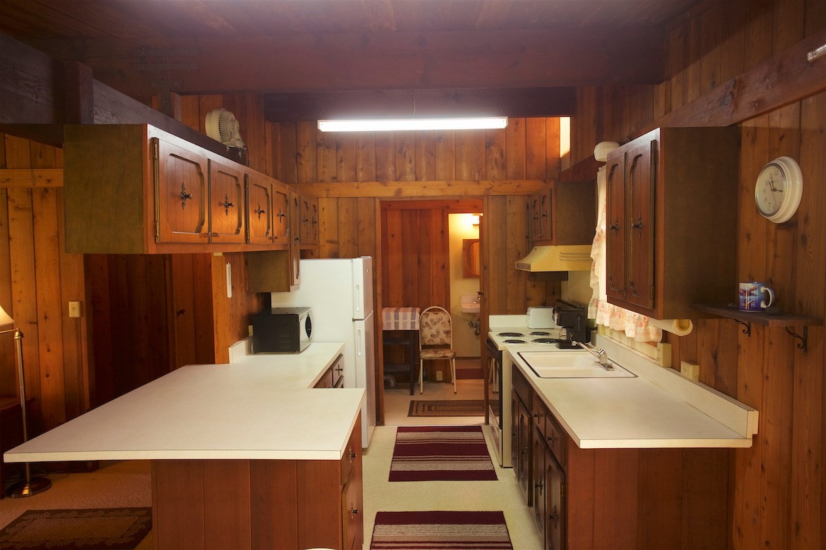 19-4096 Wright Road Volcano, HI 96785 - Photo 10 of 23 a close view of a sink a refrigerator and a stove