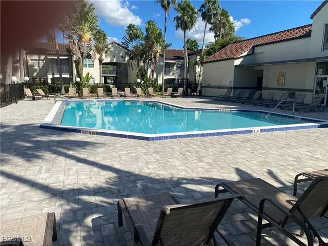 a view of a swimming pool with a patio