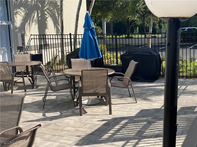a view of a chairs and tables in the patio