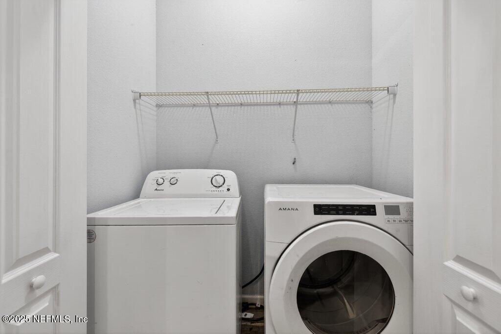 932 Puryear Street St. Augustine, FL 32084 - Photo 11 of 29 a utility room with dryer and washer