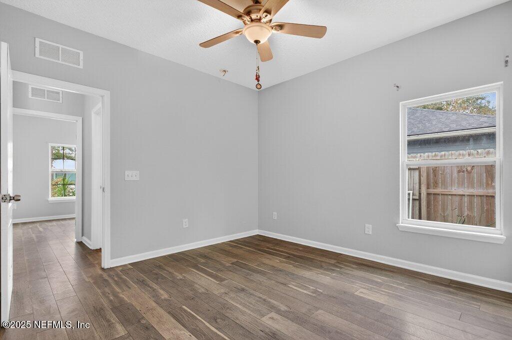 932 Puryear Street St. Augustine, FL 32084 - Photo 20 of 29 wooden floor in an empty room with a window