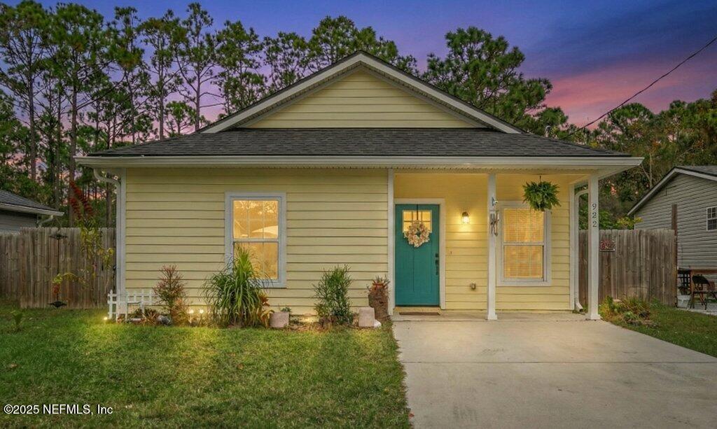 932 Puryear Street St. Augustine, FL 32084 - Photo 2 of 29 a front view of a house with a yard
