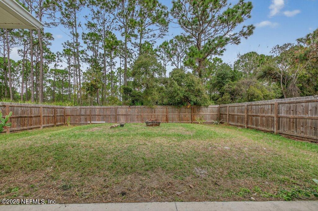 932 Puryear Street St. Augustine, FL 32084 - Photo 24 of 29 a view of a yard and a fence