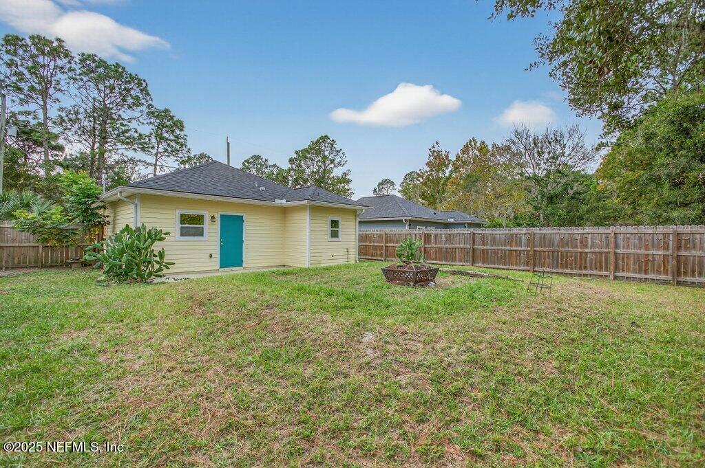 932 Puryear Street St. Augustine, FL 32084 - Photo 26 of 29 a view of backyard with green space