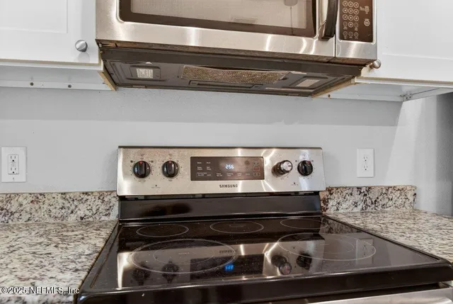 a view of a window and a white sink